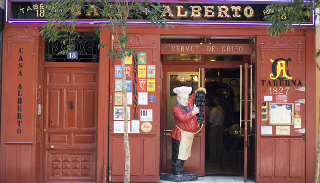 As you walk down Calle Huertas you'll spot the wooden red pannels that decorate Casa Alberto